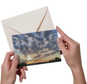 holding a new day greeting card